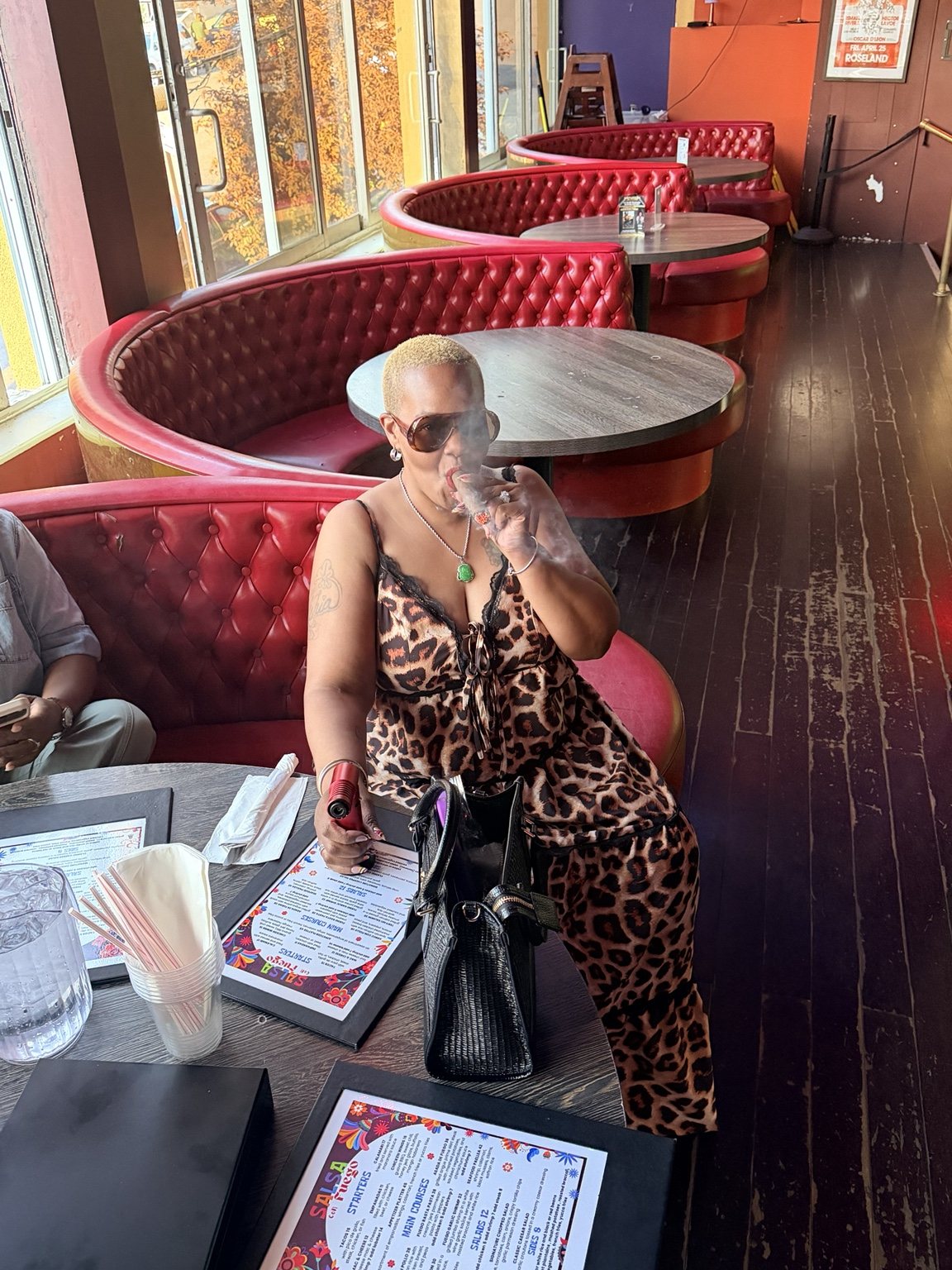 Guest enjoying a cigar in a premium lounge setting